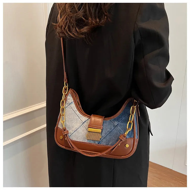 Brown denim women's shoulder bag with diamond mesh pattern and chain detail showing bucket shape