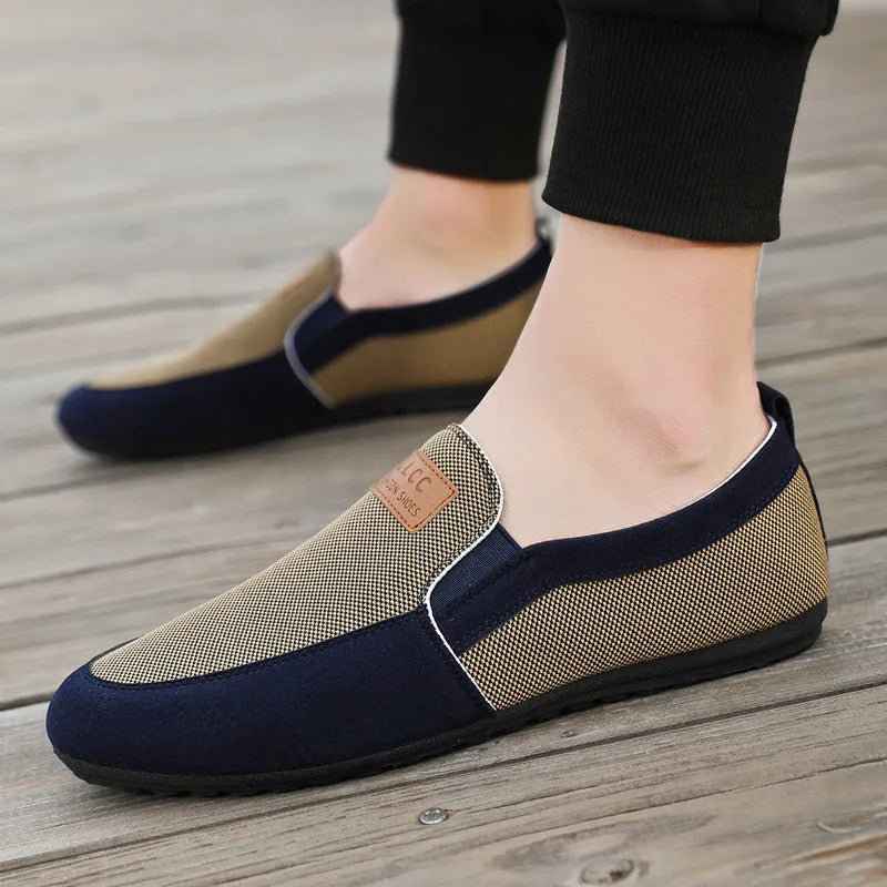 Men's grey canvas board shoes with round toe and sewing thread detail on cotton-lined upper