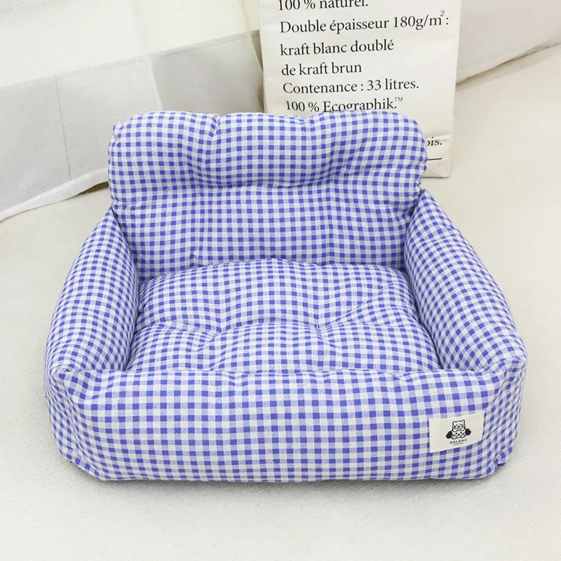 Grey and blue plaid stain-resistant fabric dog travel nests for car use, shown in small and large sizes.