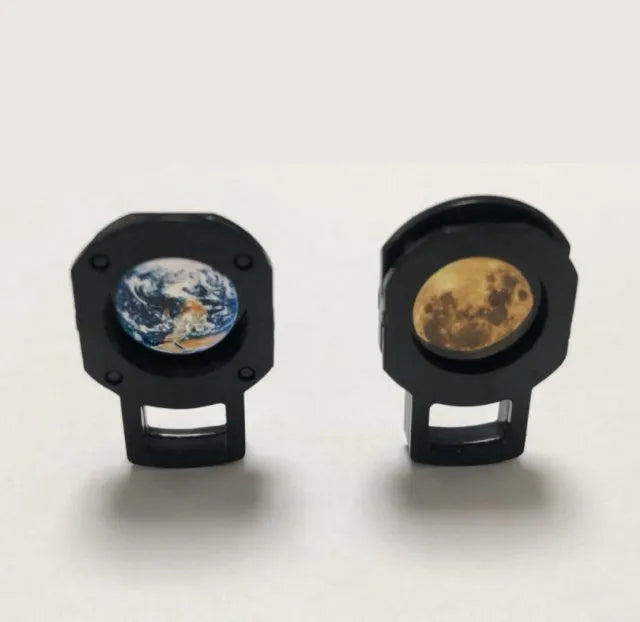 Earth and Moon star projection lamp with adjustable bracket on bedside table