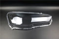 Transparent plastic headlight housing cover for car lighting replacement measuring 50x30x20mm