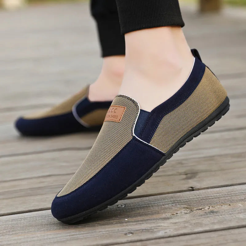 Men's grey canvas board shoes with round toe and sewing thread detail on cotton-lined upper