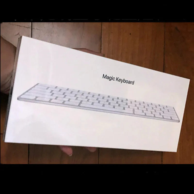White Apple G6 Bluetooth wireless keyboard with ultra-thin metal casing on desk
