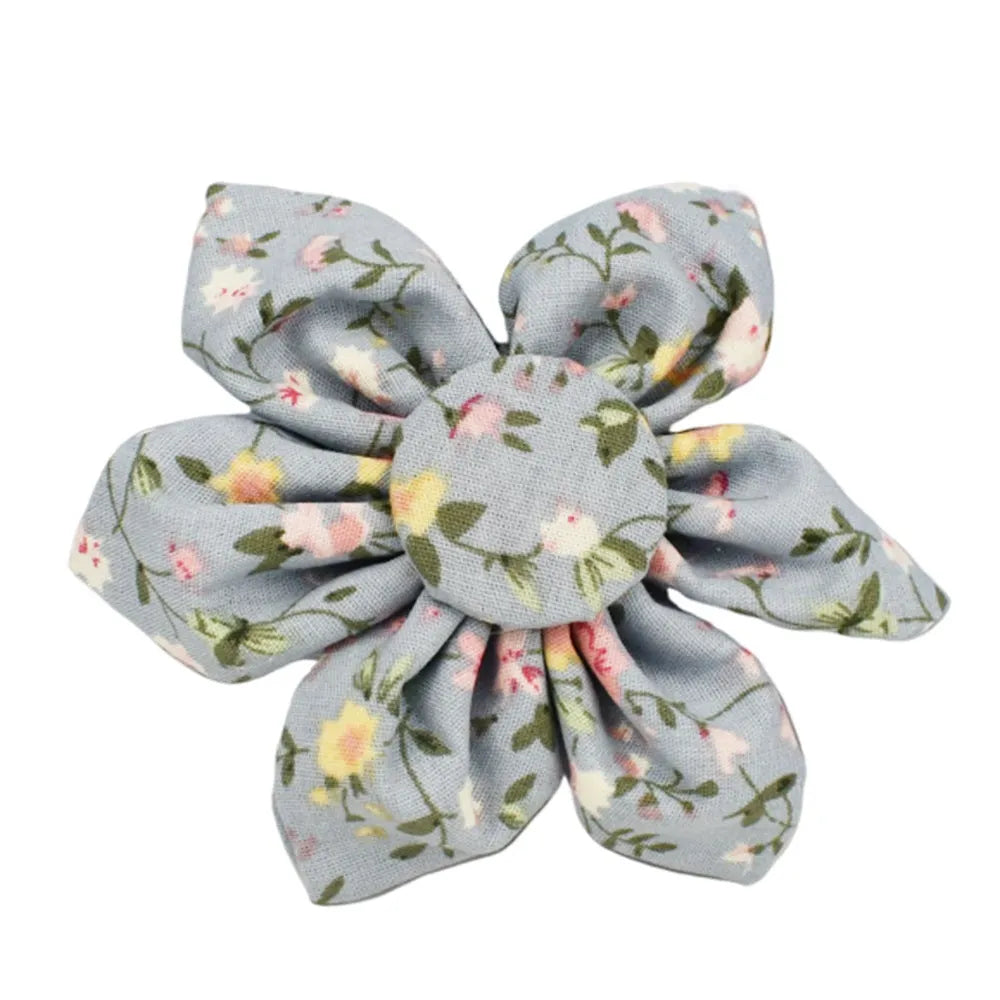 Blue floral patterned dog collar with matching accessories including leash, bow, vest, and poop bag