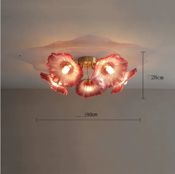 White flower pendant ceiling lamp with five flower heads emitting warm light in modern bedroom