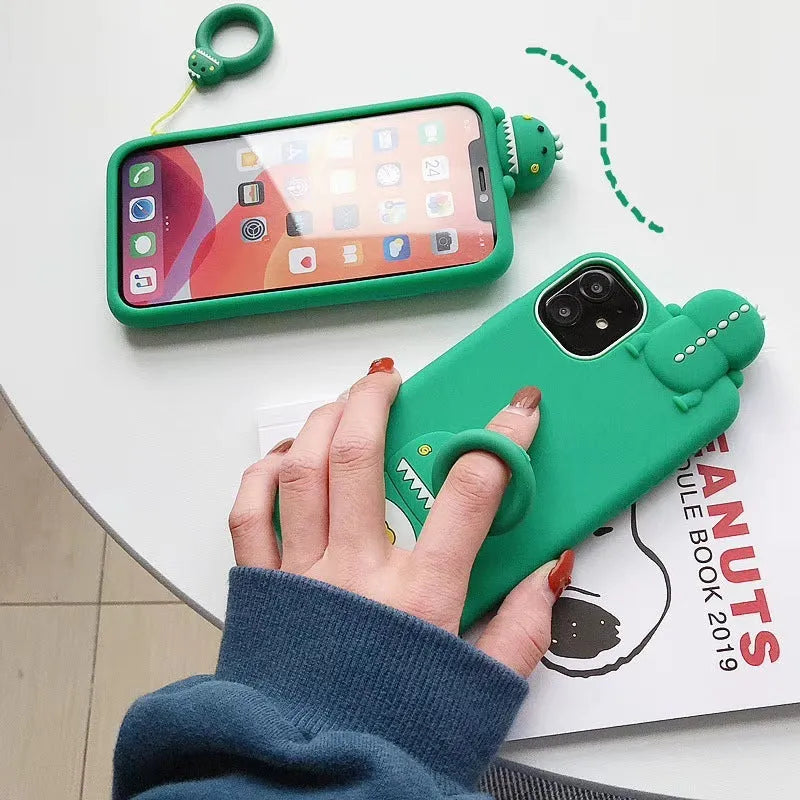 Green silicone iPhone case with animal cartoon design showing waterproof protective features