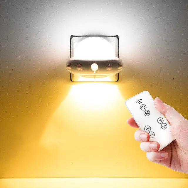 Remote control UFO shaped bedside night light in blue, pink, or white colour options.