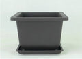 Dark brown antique-style plastic flowerpot in recycled material, showing classic design for indoor or balcony plants
