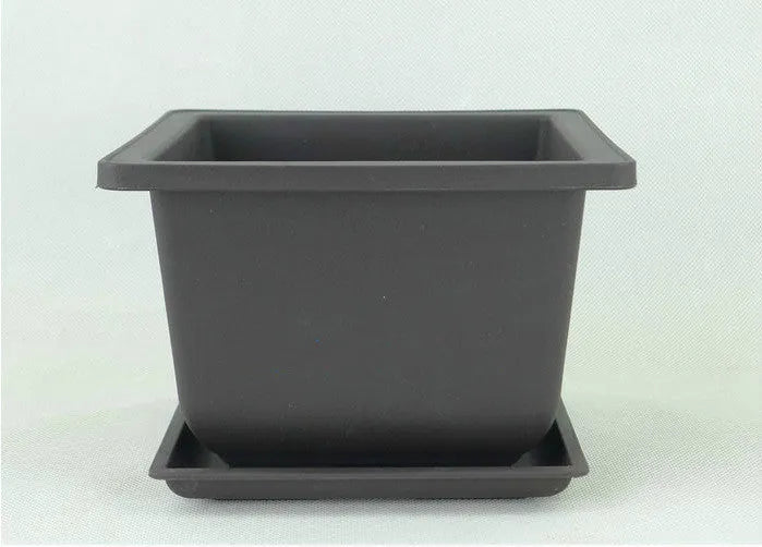 Dark brown antique-style plastic flowerpot in recycled material, showing classic design for indoor or balcony plants