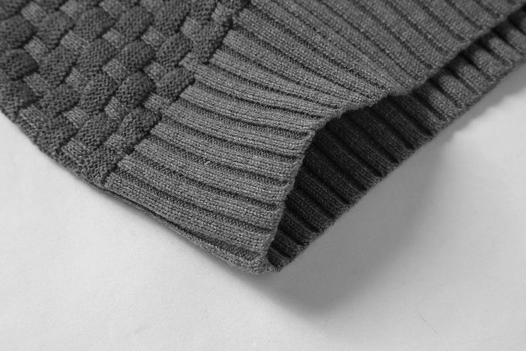 Men's black hooded sweatshirt made from cotton and polyester blend fabric on a grey background.