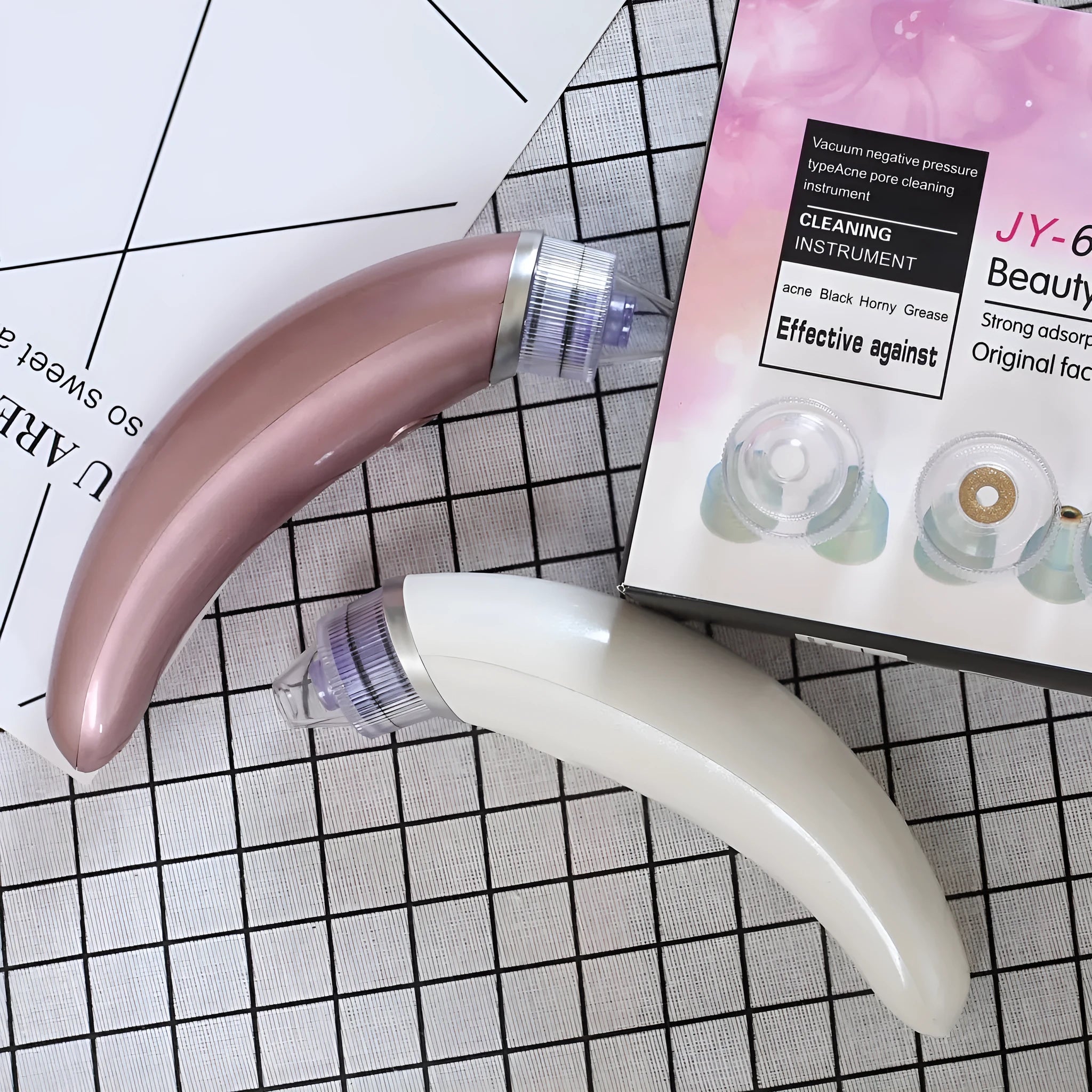 Rose gold and white electric blackhead suction instrument for facial pore cleansing