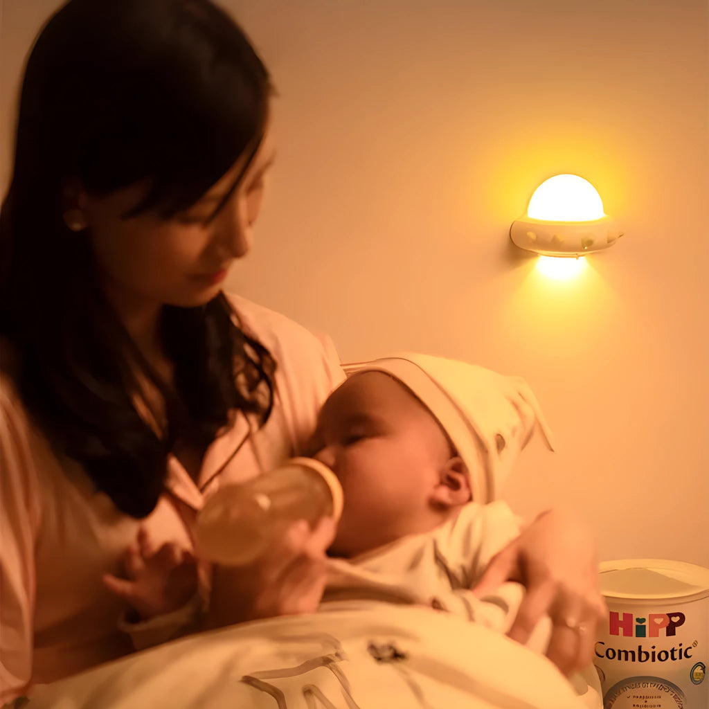Remote control UFO shaped bedside night light in blue, pink, or white colour options.