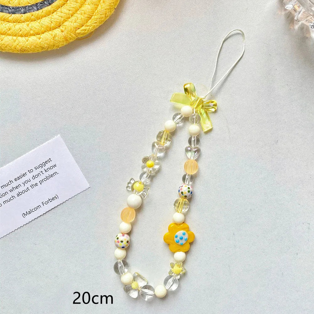 Beaded flower mobile phone lanyard with plastic resin decoration in blue, pink or yellow colours