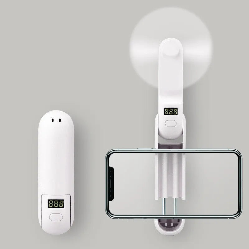 Folding mini USB desk fan in green showing compact folded and unfolded positions