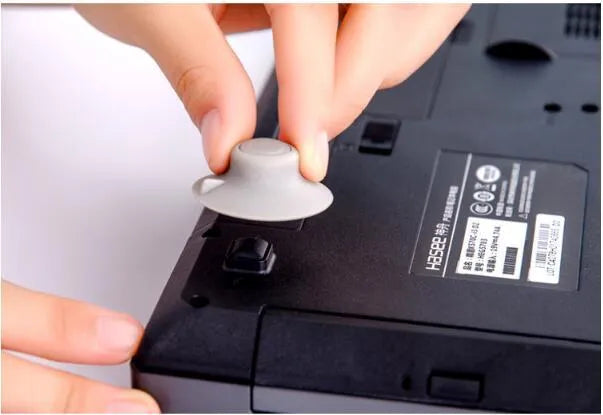 Grey plastic laptop cooling pad stand with large and small non-slip pads