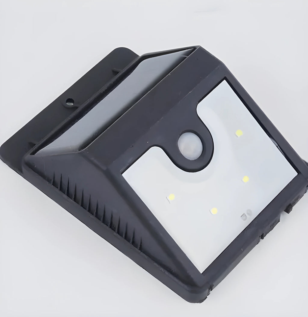 Four solar-powered LED outdoor sensor lights with wall mounting hardware