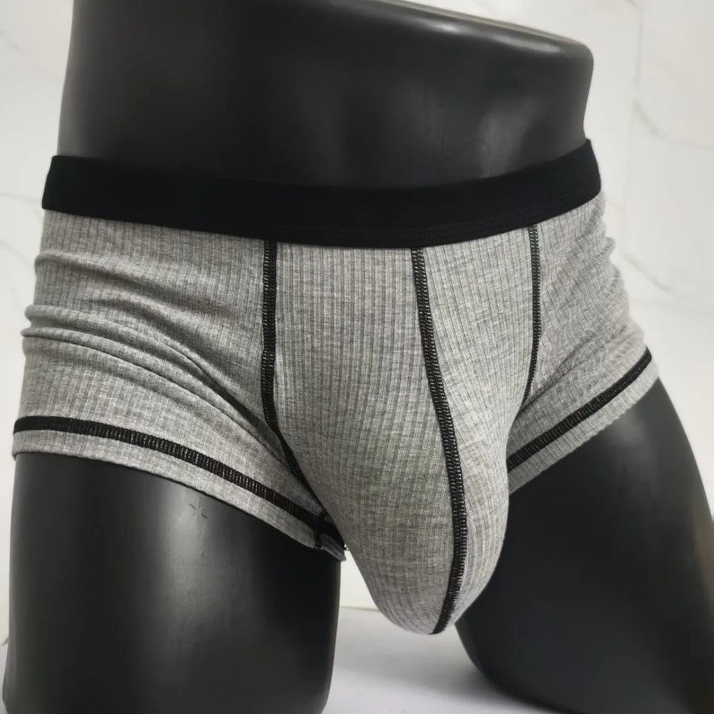 Men's solid colour boxers showing hip lifting and body shaping design in breathable fibre fabric