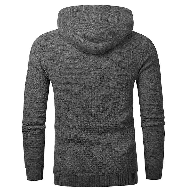 Men's black hooded sweatshirt made from cotton and polyester blend fabric on a grey background.