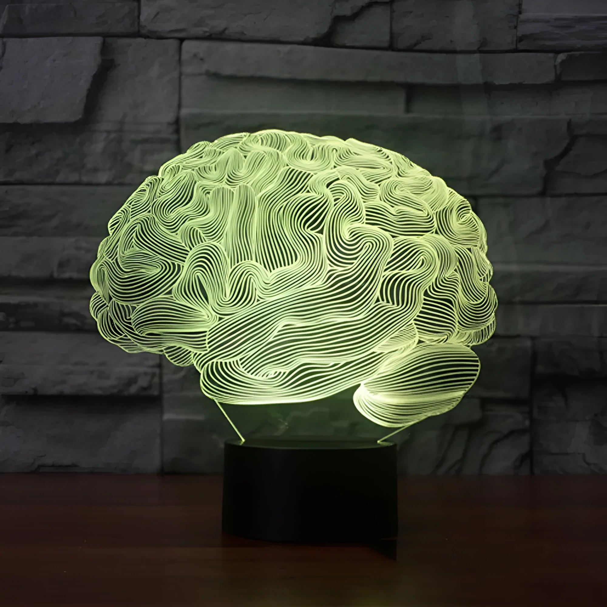 3D acrylic illusion desk lamp with colour-changing LEDs and a black ABS base on a wooden surface.