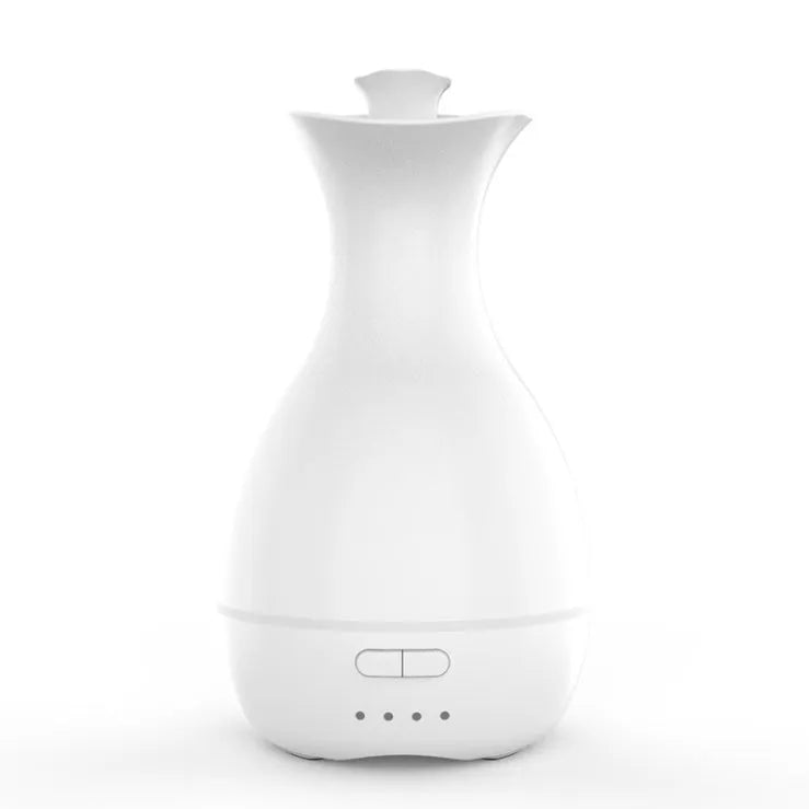 White ultrasonic aromatherapy diffuser with colourful LED light misting essential oils