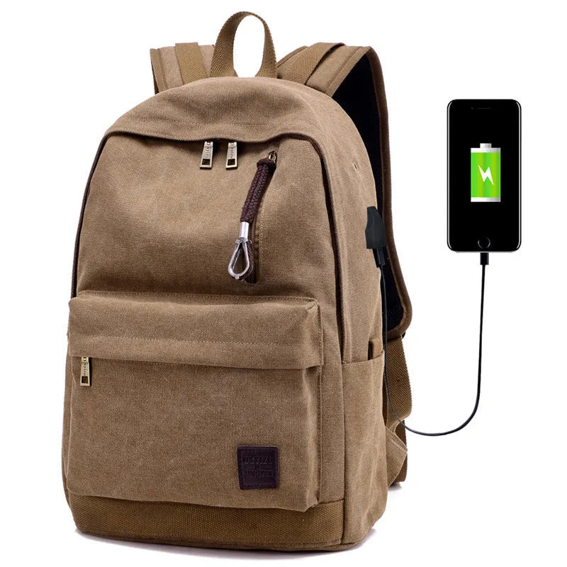 Canvas backpack in grey colour showing USB charging port, front zipper pocket, and adjustable shoulder straps