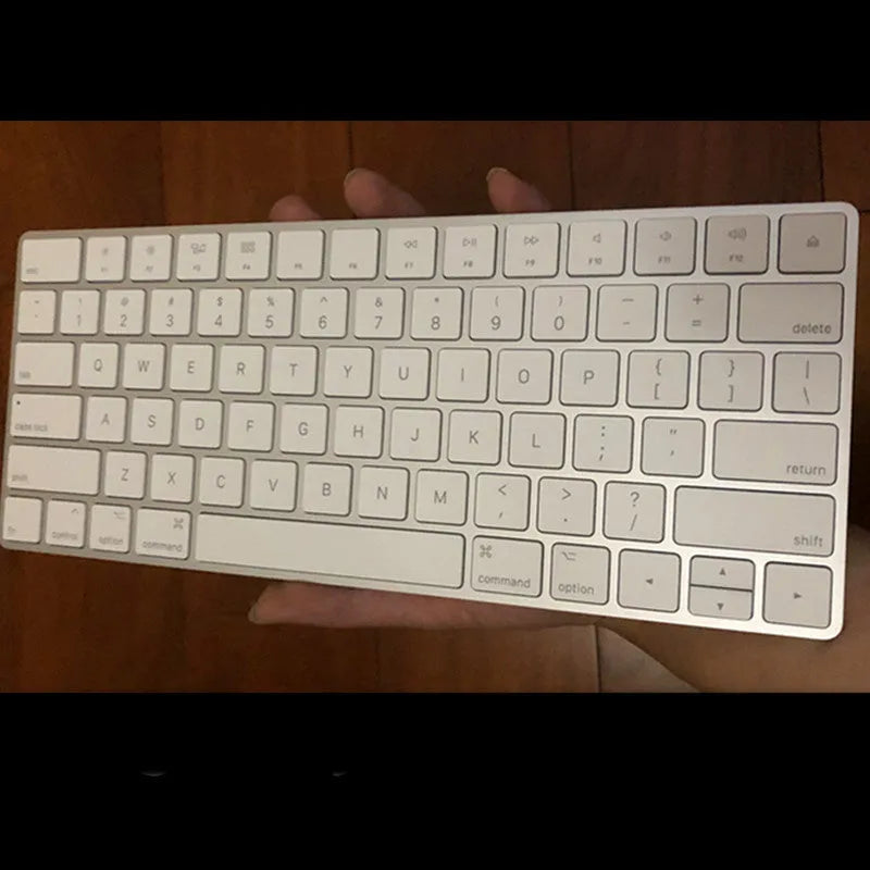 White Apple G6 Bluetooth wireless keyboard with ultra-thin metal casing on desk