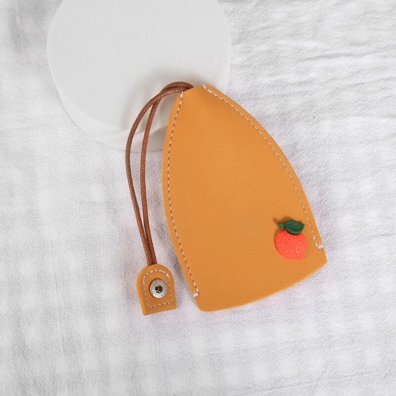Cartoon PU leather pull-out car key case measuring 14 x 7.5cm with colourful designs
