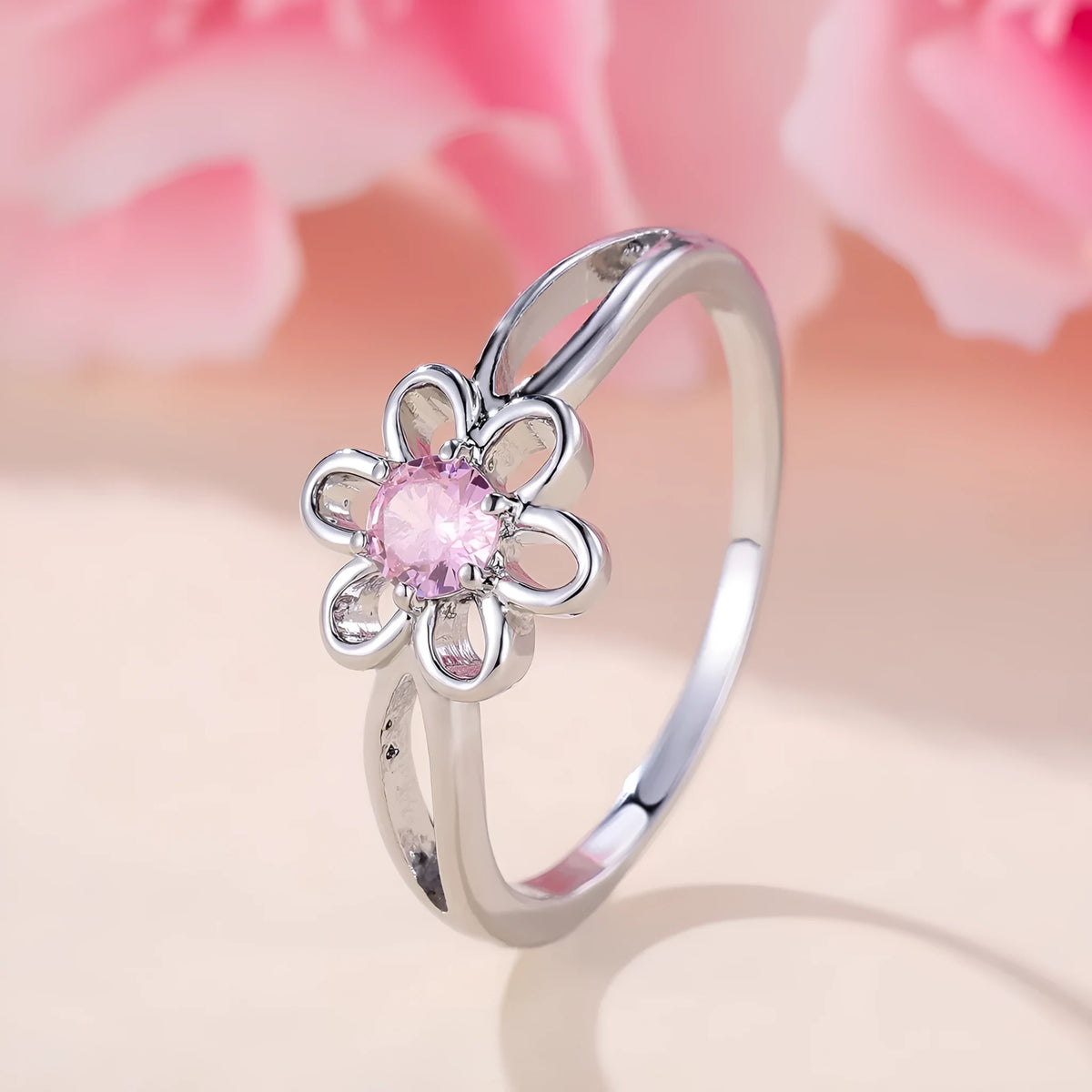Women's hollowed floral copper ring with electroplated platinum pink diamond finish