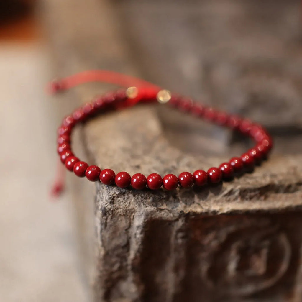 Handmade natural cinnabar bracelet with geometric auspicious patterns in purple gold sand colour