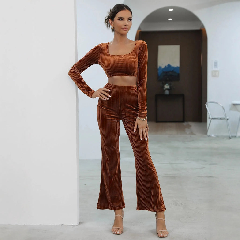 Caramel-colour long sleeve sweater and matching trousers casual set on a hanger.