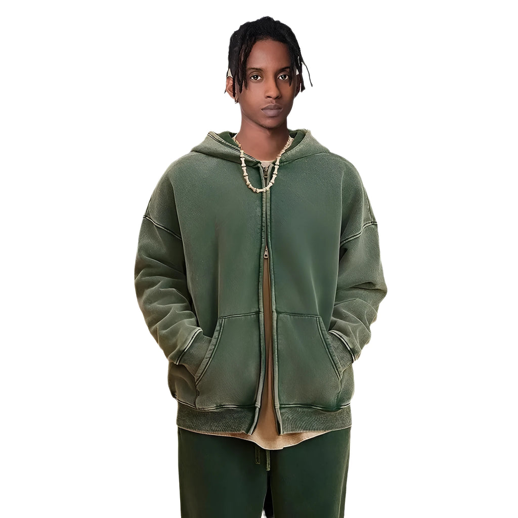 Man wearing a washed black fleece-lined hooded cardigan with a double zipper front.