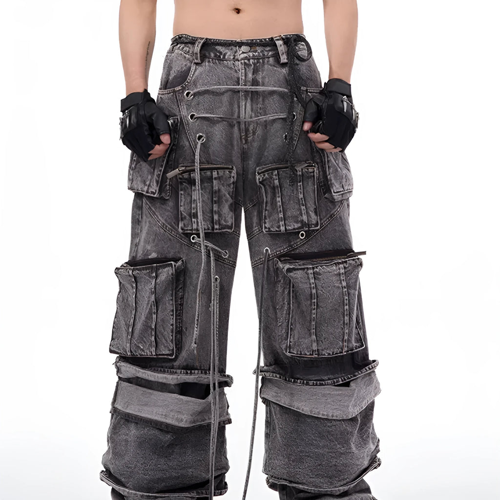Grey distressed denim overalls with rope stitching on the legs, shown in a casual fit.