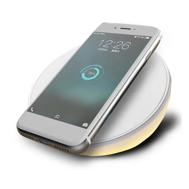 White wireless charging pad with clock display and alarm functions for smartphone bedside charging