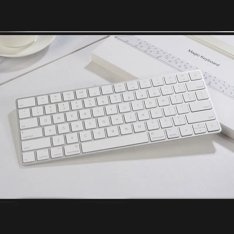 White Apple G6 Bluetooth wireless keyboard with ultra-thin metal casing on desk