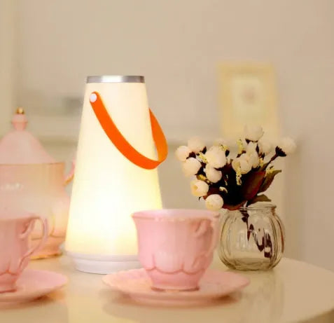 White rechargeable bedside table lamp with USB charging cable and touch control for adjustable brightness
