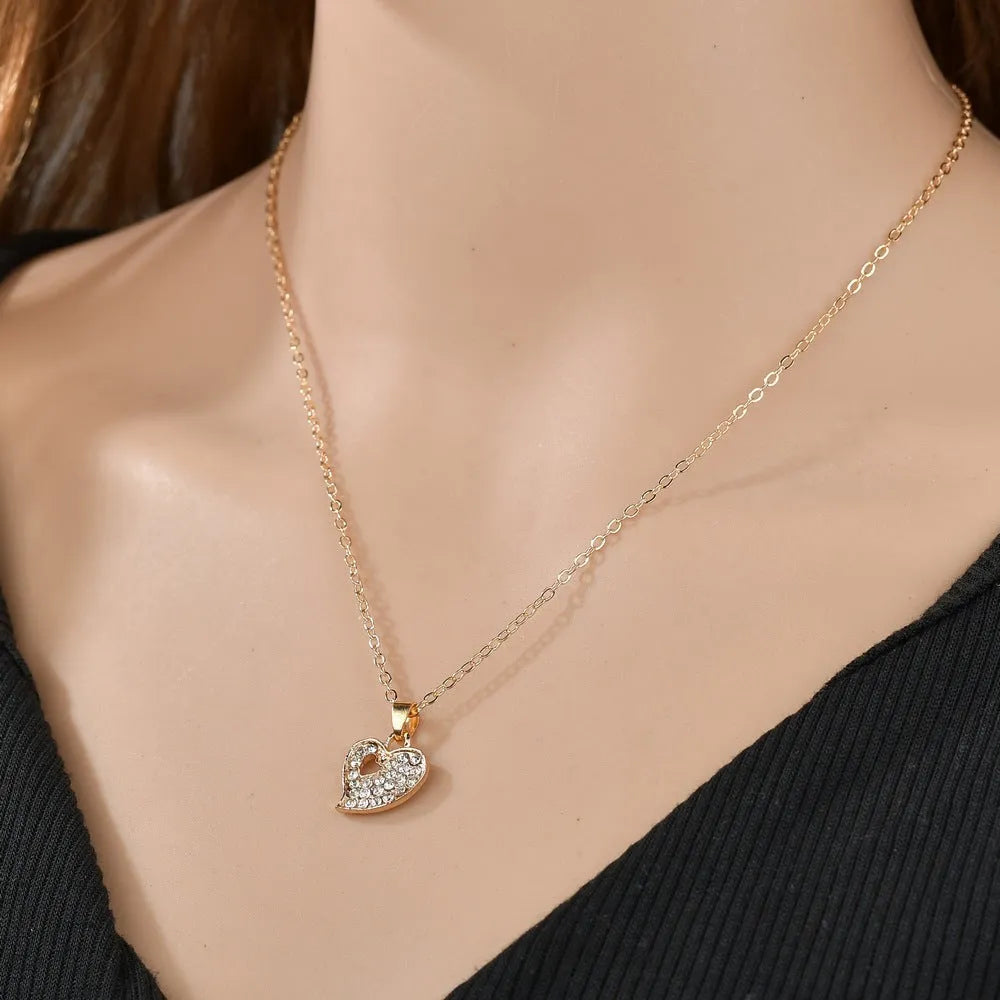 Gold tone love symbol jewellery set with earrings, pendant necklace and bracelet on 21-50cm adjustable chain