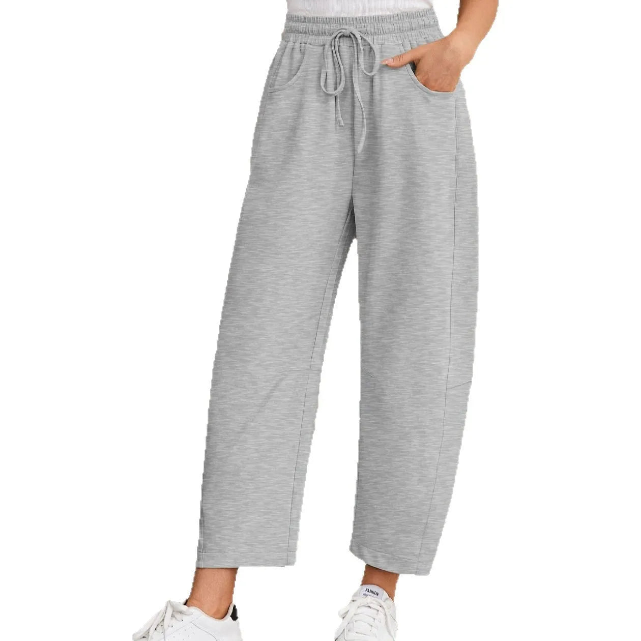 Loose cotton cropped sweatpants with drawstring waist in apricot colour showing street fashion styling