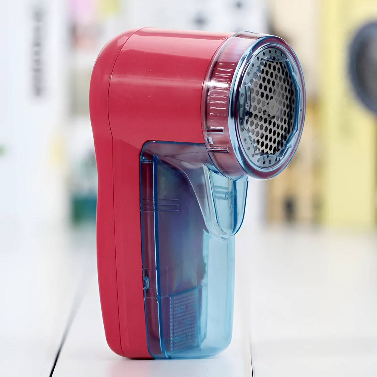 Portable electric lint remover device in selected colour with compact handheld design