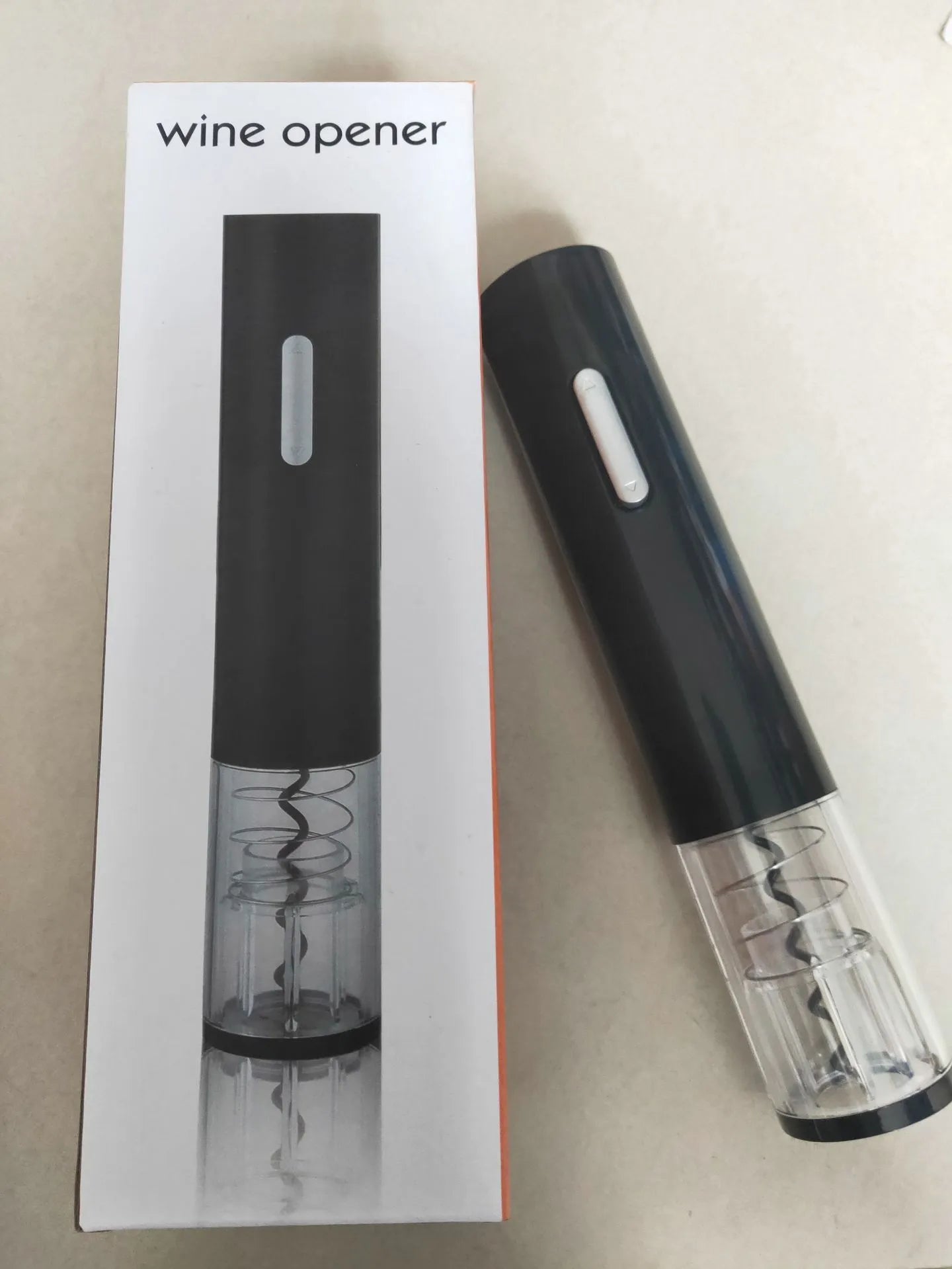 Automatic electric wine bottle opener with foil cutter in black, red, or white colours.