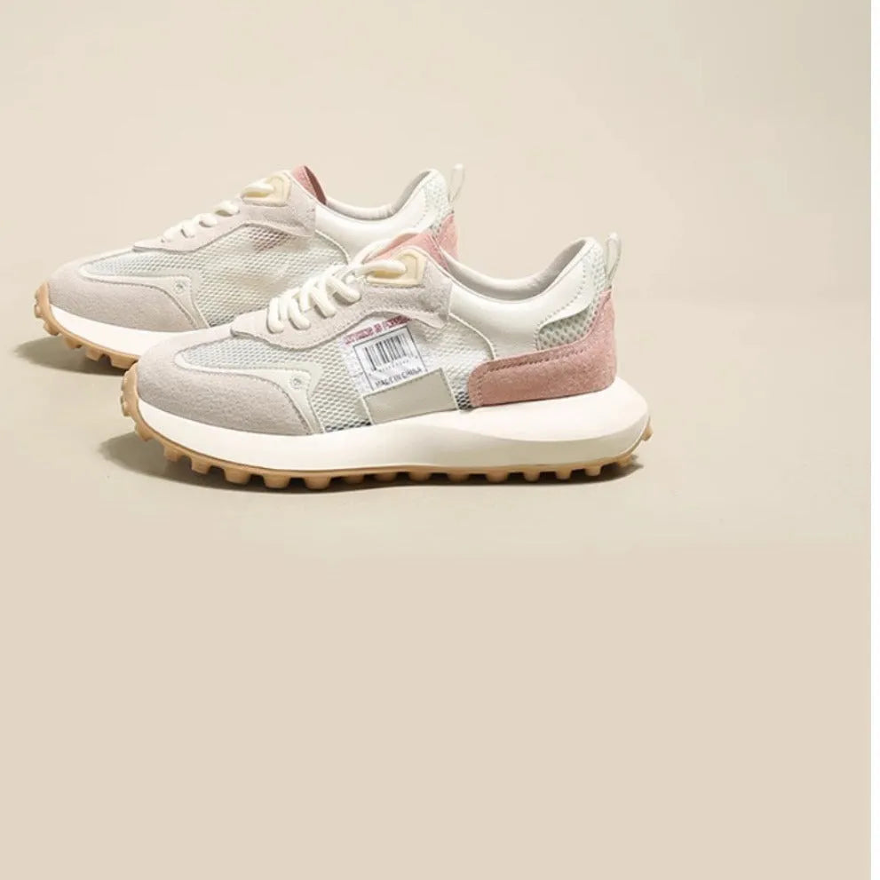 Women's grey and pink retro sneakers with low top design and rubber sole