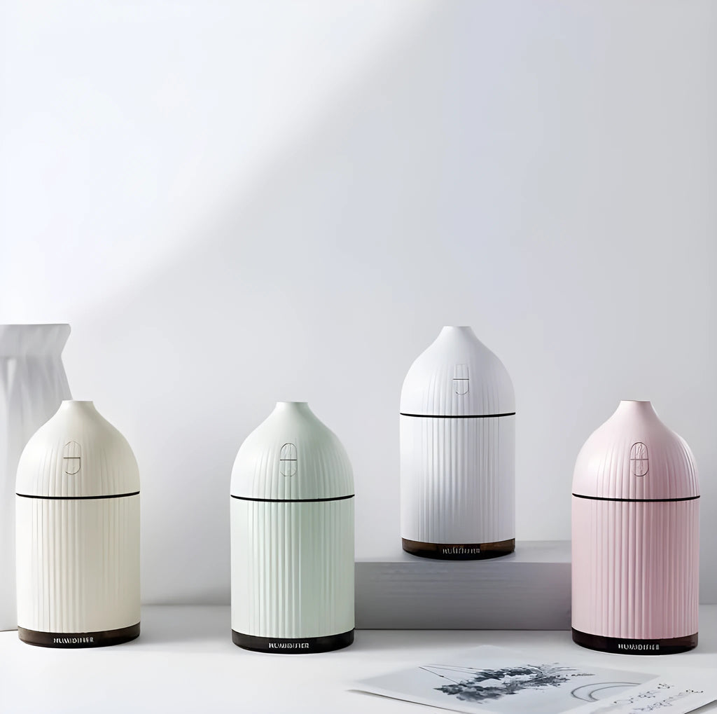 White ultrasonic aromatherapy diffuser humidifier with LED light and 300ml water bottle.