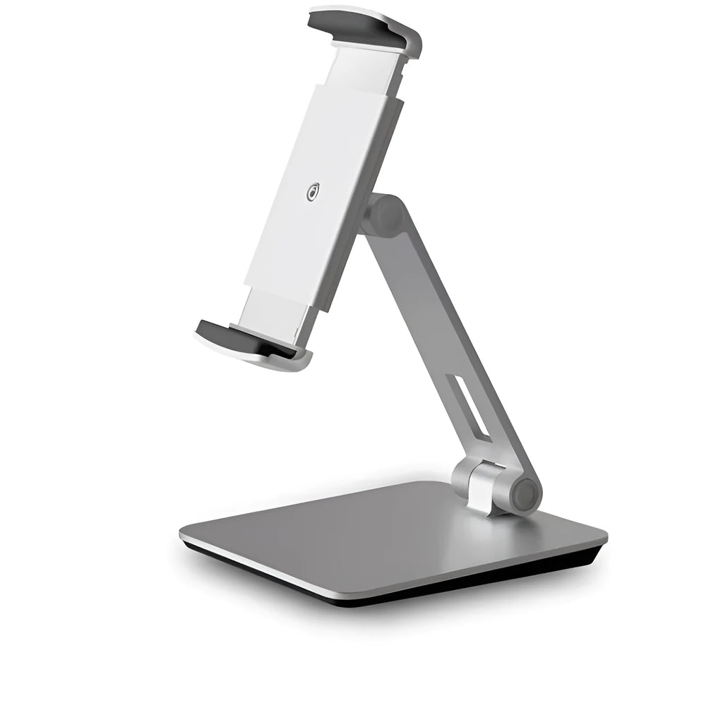Silver foldable aluminium phone and tablet holder on a desk, showing 360-degree rotation feature.