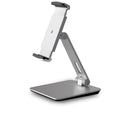 Silver foldable aluminium phone and tablet holder on a desk, showing 360-degree rotation feature.