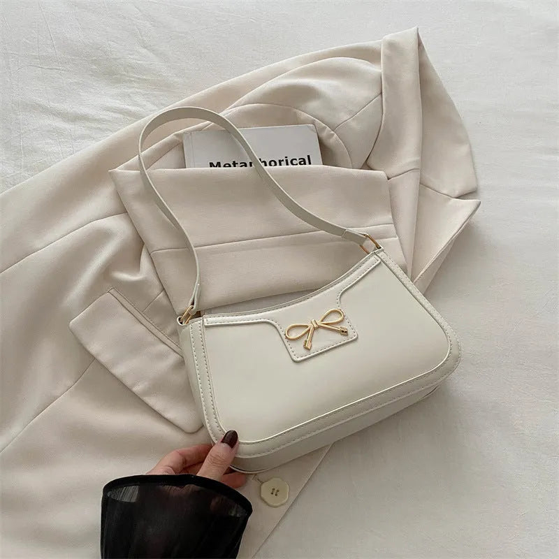 Western-style baguette shoulder bag in PU leather with bow detail, 24cm wide