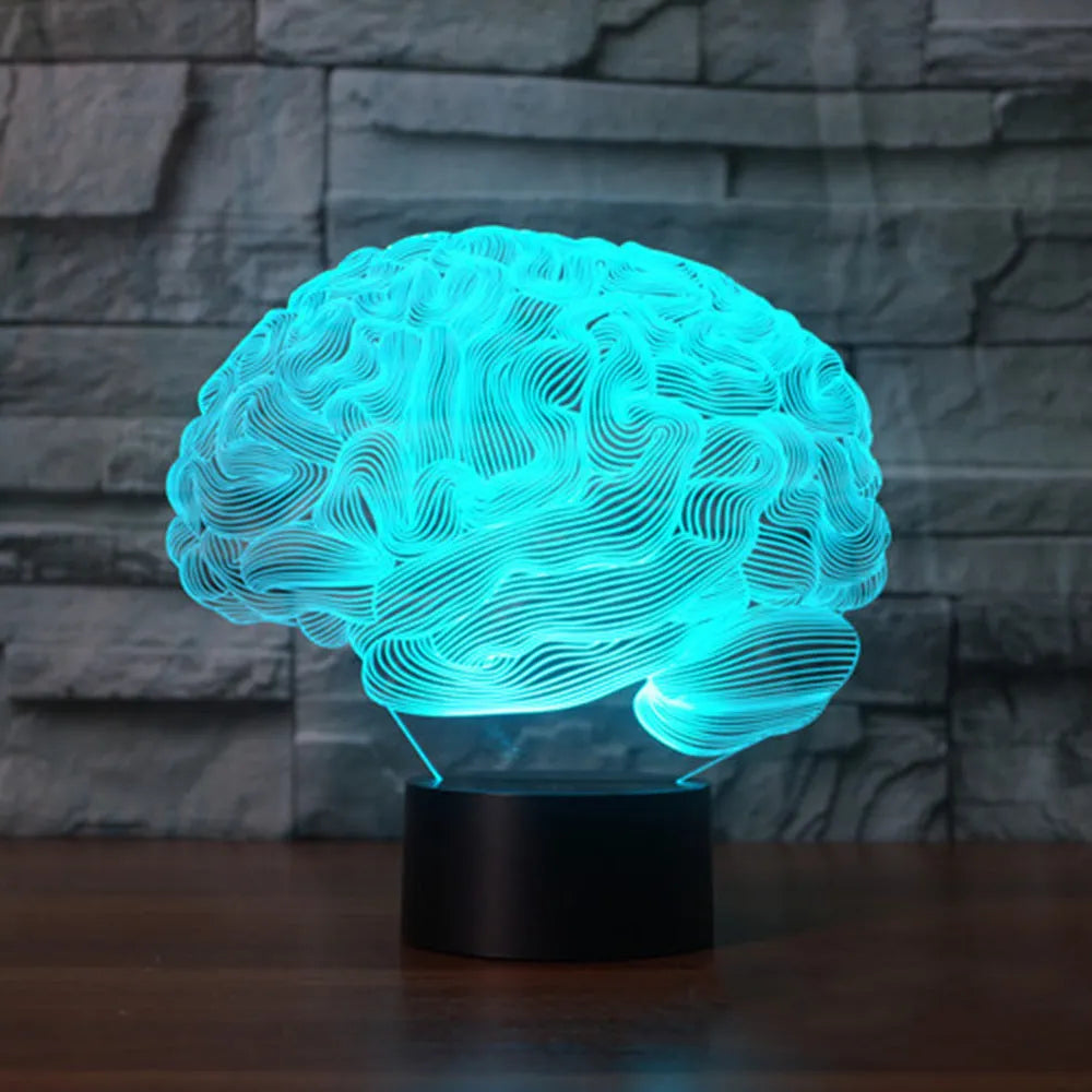 3D acrylic illusion desk lamp with colour-changing LEDs and a black ABS base on a wooden surface.