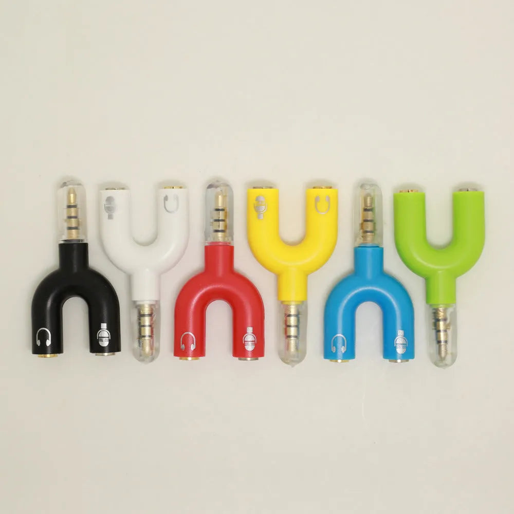 A compact white 3.5mm headphone splitter adapter with two female ports and one male jack.