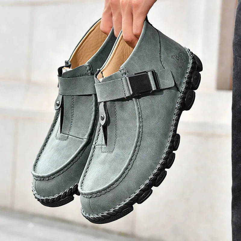 Handmade stitching casual flat bottom slip-on lazy shoes in black PU leather on a white background.