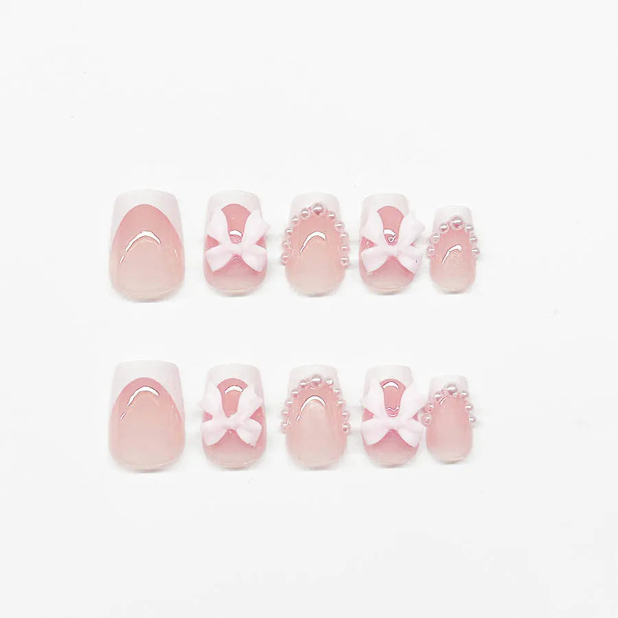 Short white French press-on nails with bow and tulip designs in European square shape