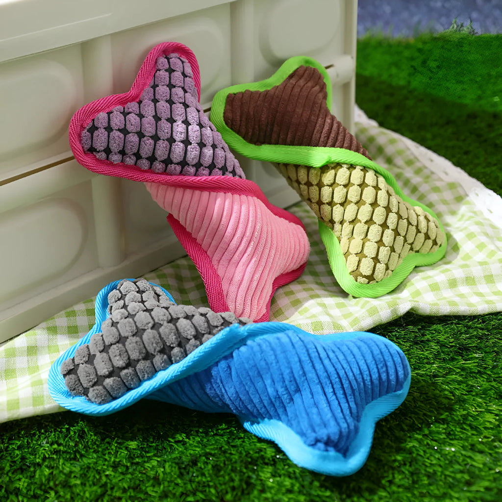 Blue teddy dog toy with a squeaker bone model, showing soft plush and corn fleece lining.