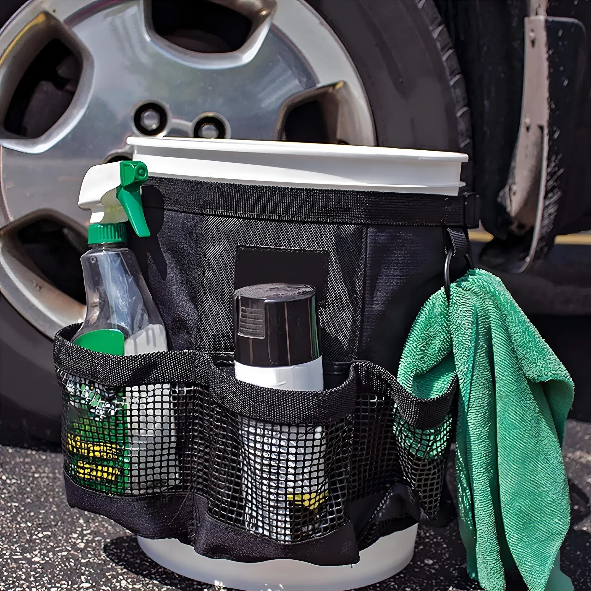 Black polyester cylindrical hanging storage bag designed for 5 gallon barrels